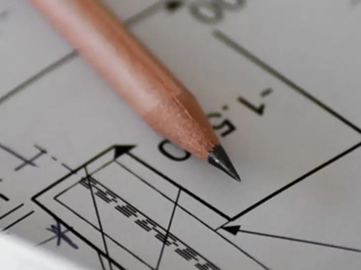 Close-up of a pencil on a stormwater pollution prevention plan blueprint.