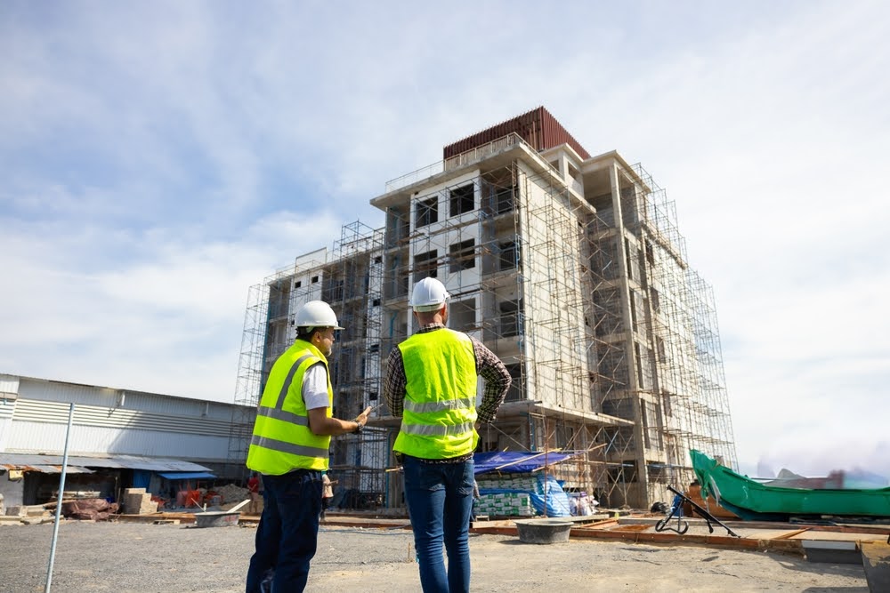 An inspector on a construction site ensuring TCEQ requirements for SWPPP are met.